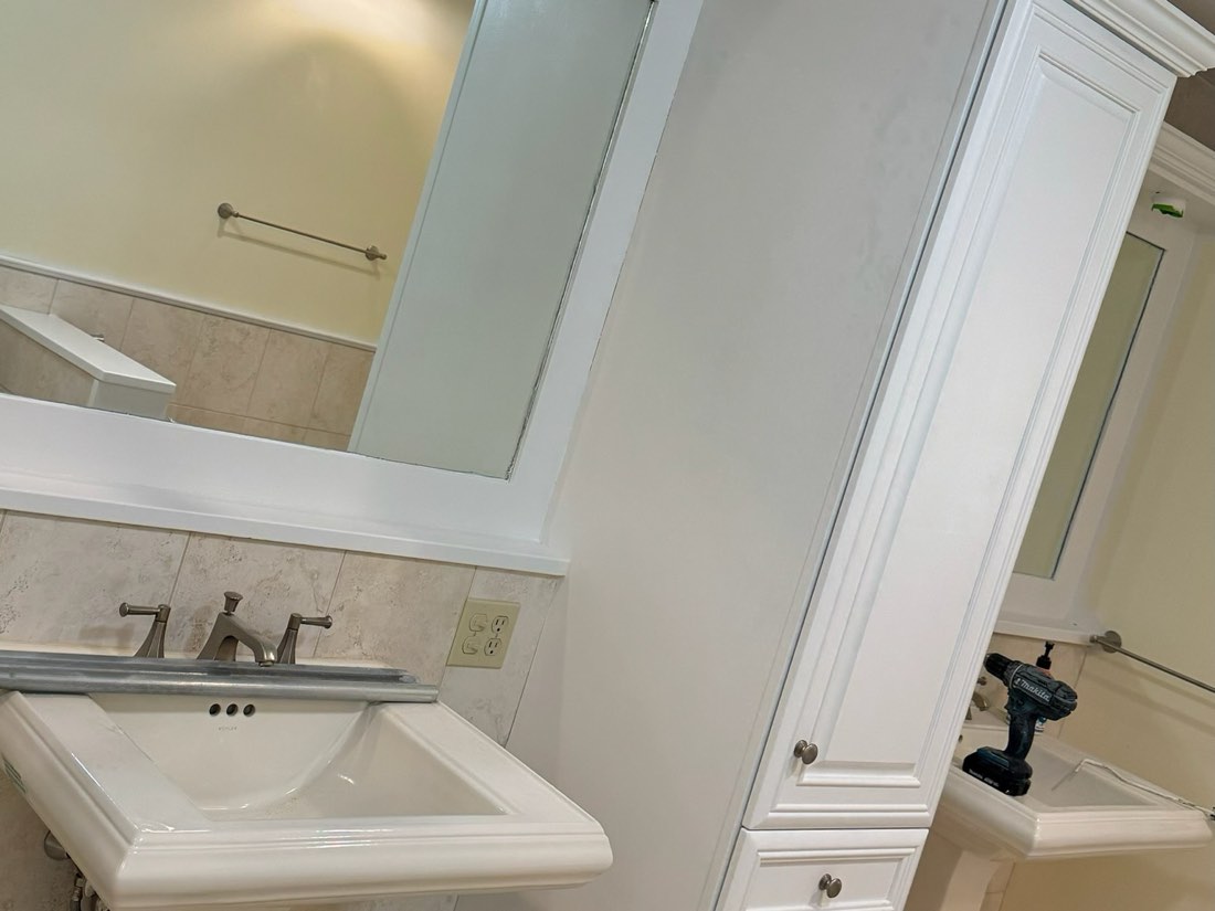 Bathroom vanity and linen tower refinished white