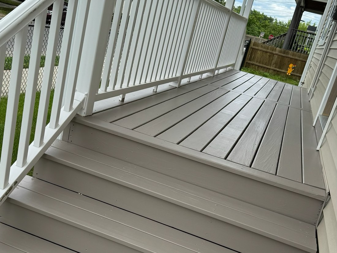Porch decking, steps and railings finished in grey and white