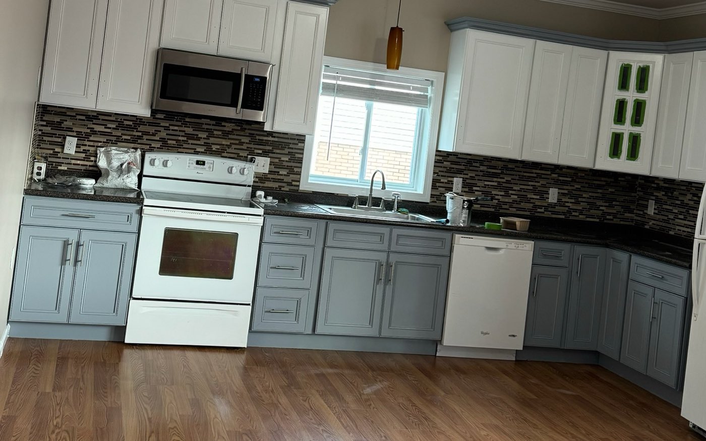 Kitchen finished by Prime Paint with white upper cabinets and grey lower cabinets